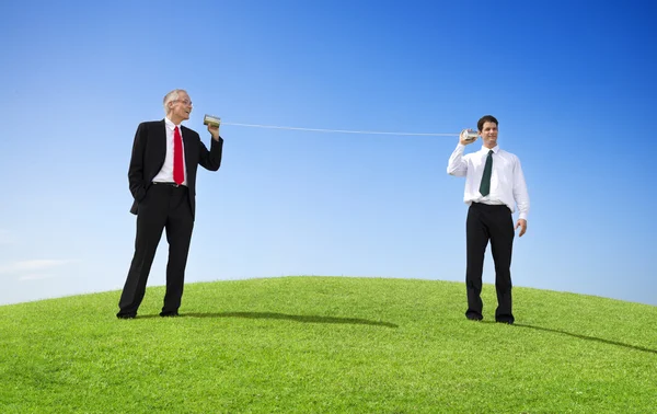 Businessmen Talking Through Tin Can Phone — Stock Photo, Image