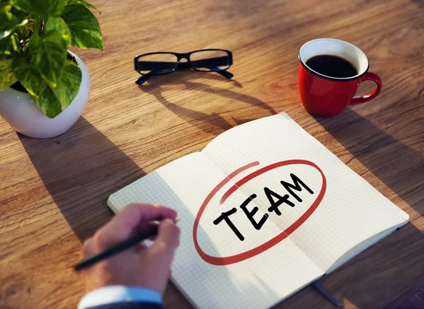 Businessman Writing Word 'Team' — Stockfoto