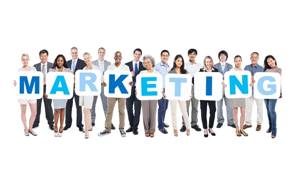 People Holding word Marketing — Stock Photo, Image