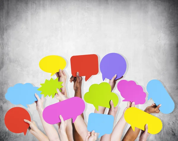 Arms raised with speech bubbles — Stock Photo, Image