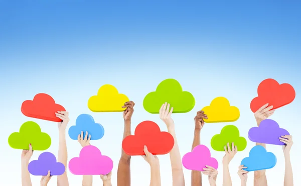 Hands holding cloud shaped speech bubbles — Stock Photo, Image