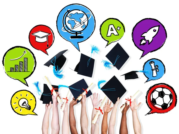 Arms throwing graduation hats — Stock Photo, Image