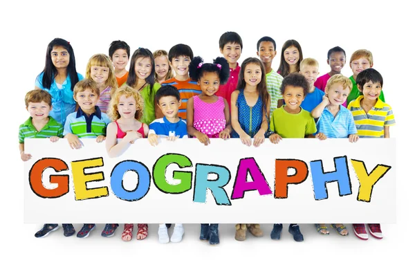 Diverse Cheerful Children Holding the Word Geography — Stock Photo, Image