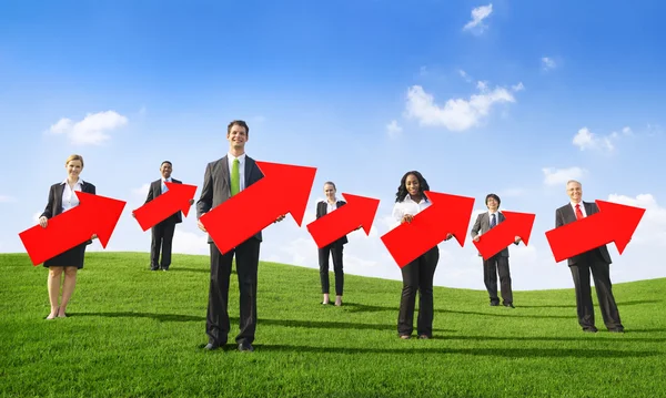 Business People Holding Arrows — Stock Photo, Image