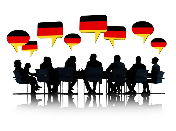 Obchodní lidé siluety s německé vlajky — Stock fotografie