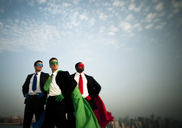 Business superheroes at city skyline — Stock Photo, Image