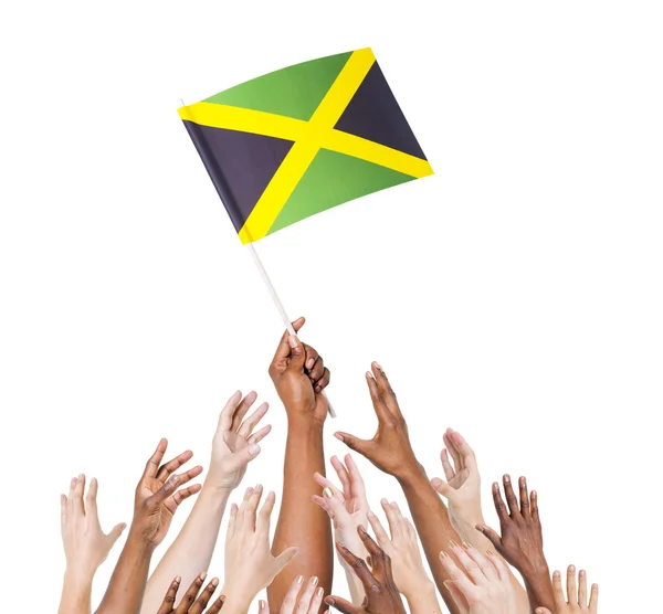 Mensen bedrijf vlag van jamaica — Stockfoto