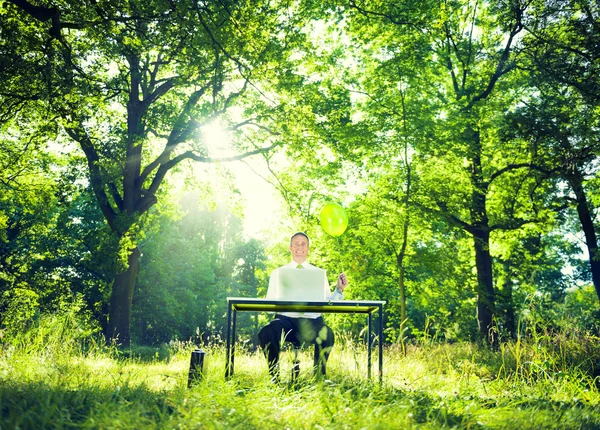 Businessman working with nature — Stock Photo, Image