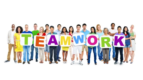 People holding placards forming teamwork — Stock Photo, Image