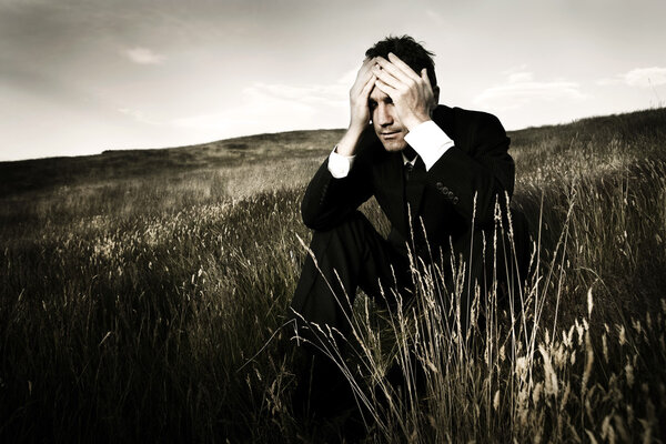Businessman depressed about life