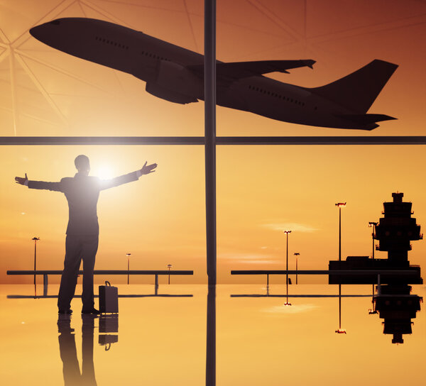 Businessman and airplane in airport