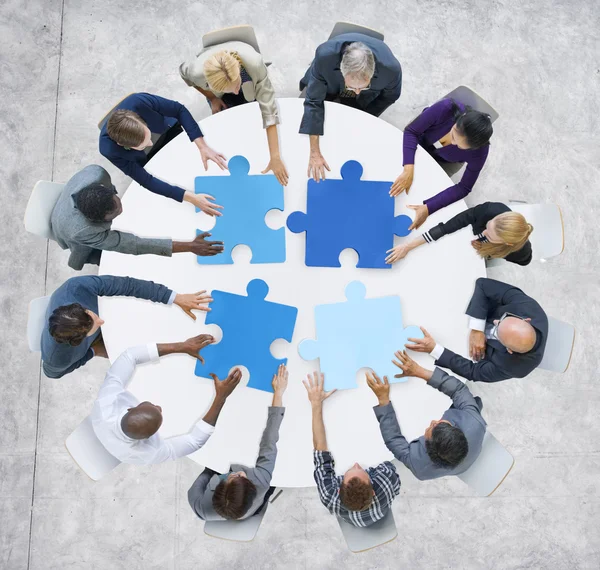 Business People and Jigsaw Puzzle Pieces — Stock Photo, Image