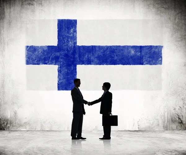 Two Businessmen Shaking Hands With Finnish Flag — Stock Photo, Image