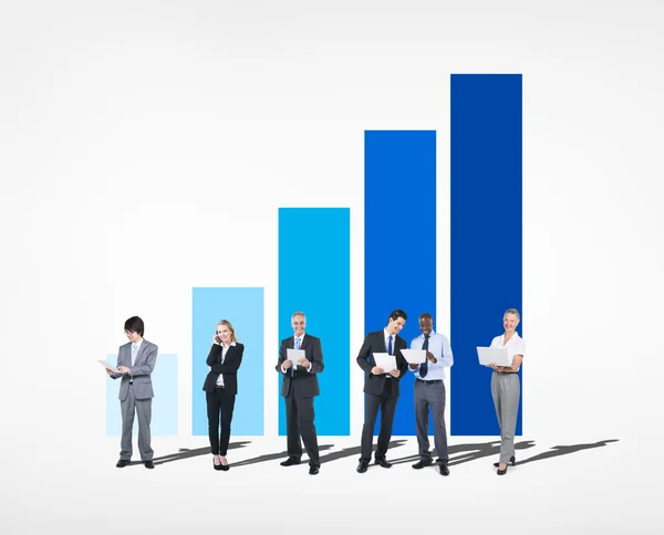 Business people near bar graph — Stock Photo, Image