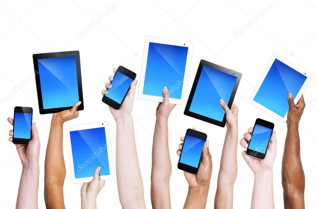 Hands holding smartphones and tablets