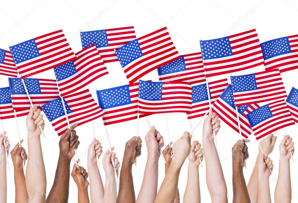 People holding USA flags