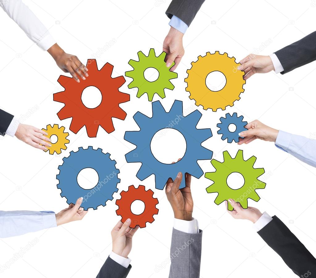 Business People Holding Gears