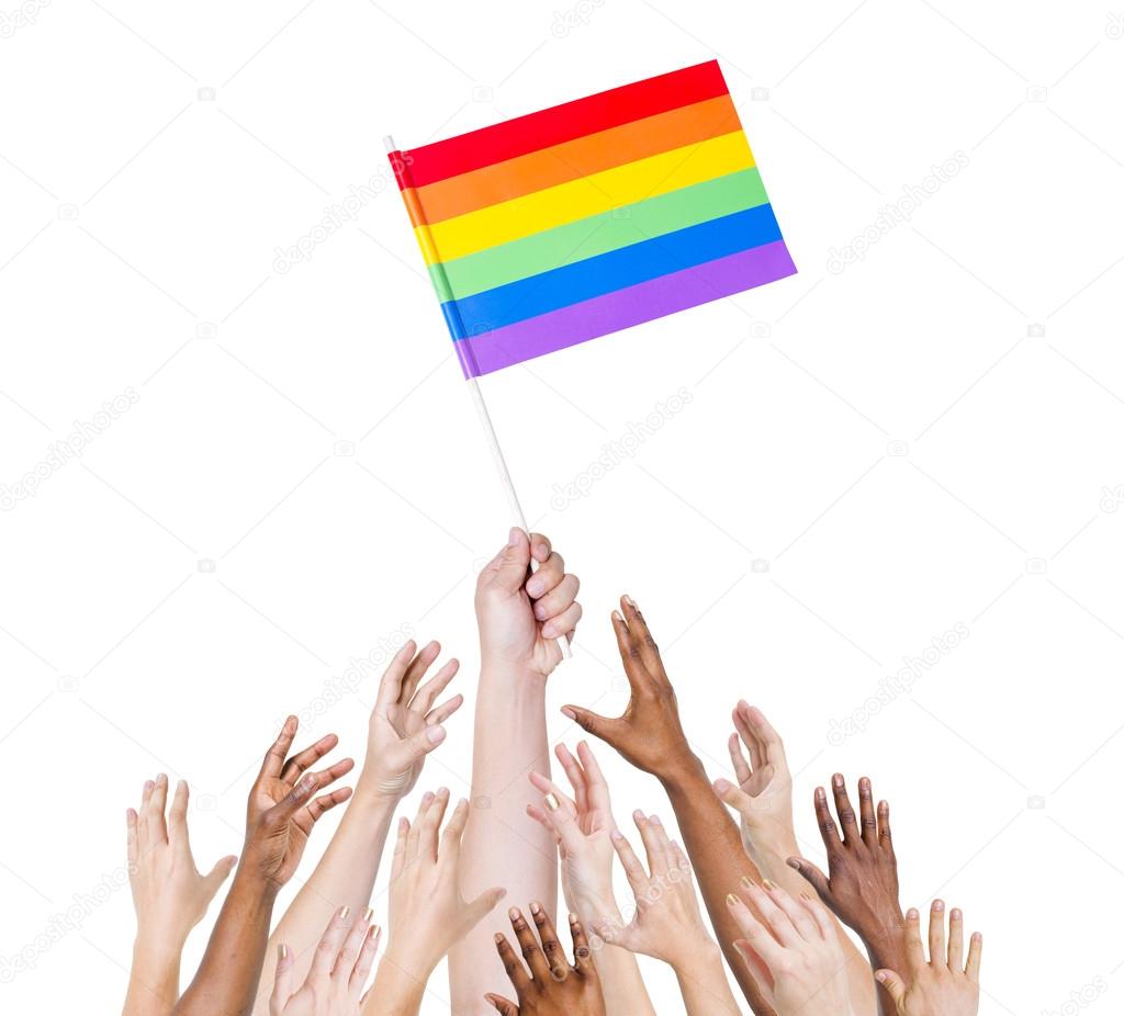 Human hand holding LGBT Flag