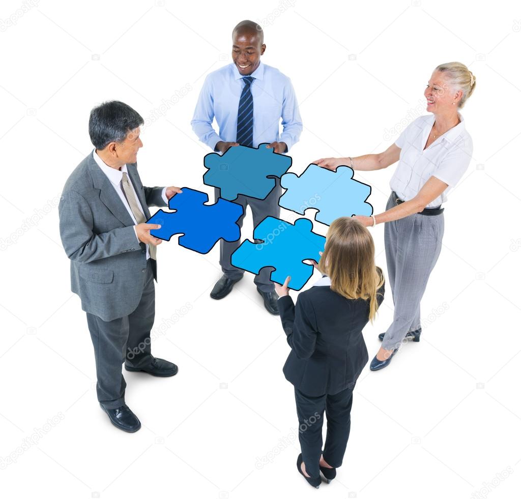 Business People Connecting Jigsaw Puzzles