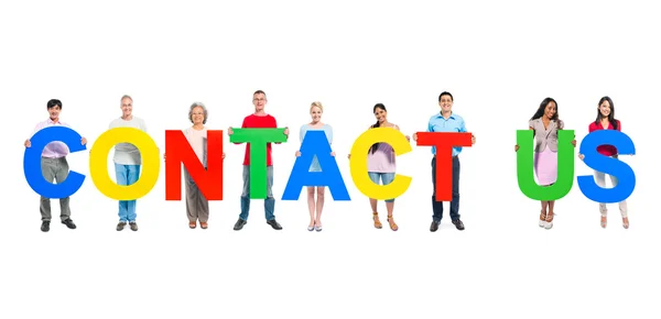 Business people holding the letters "CONTACT US" — Stock Photo, Image
