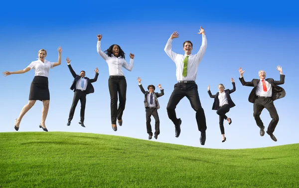 Group of business people jumping — Stock Photo, Image