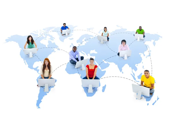 People with laptops on world map — Stock Photo, Image