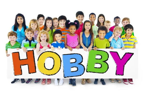 Τα παιδιά κρατώντας λέξη χόμπι — Φωτογραφία Αρχείου