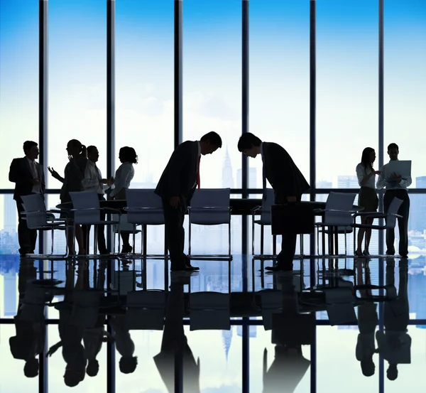 Business People Bowing Down in Office — Stock Photo, Image