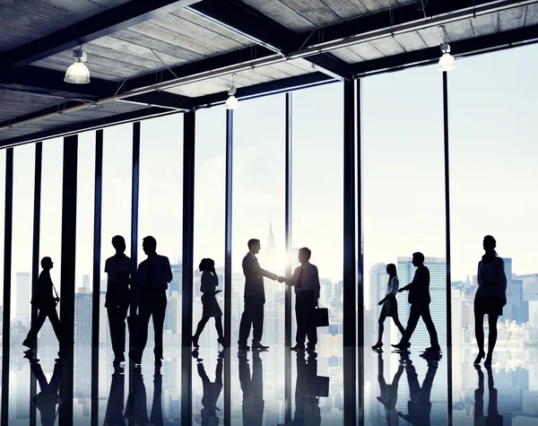 Business people standing near window — Stock Photo, Image