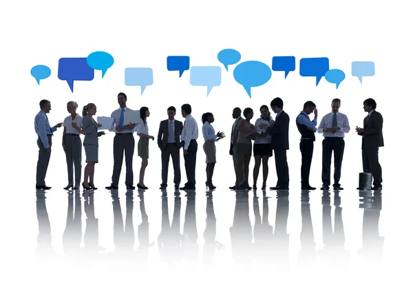 Business people with speech bubbles — Stock Photo, Image