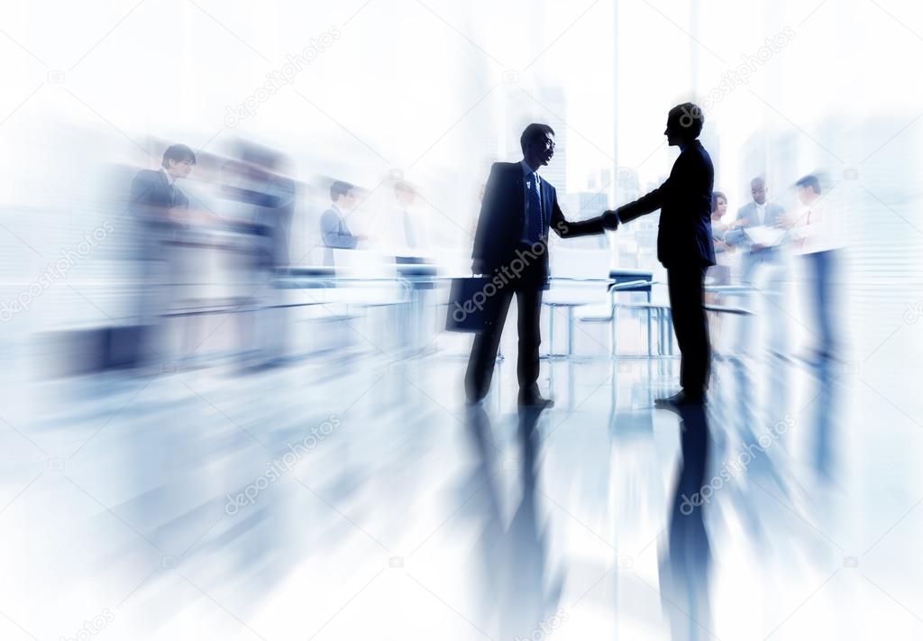 Two Businessmen Handshaking