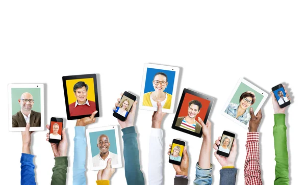 Hands Holding Digital Devices with People's Faces — Stock Photo, Image