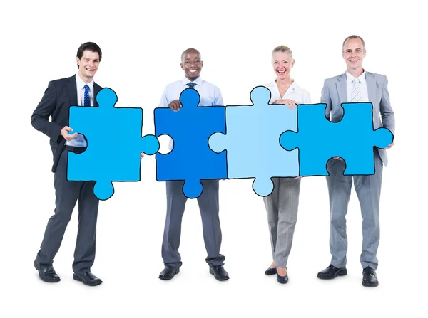 Business People Holding Puzzle Pieces — Stock Photo, Image