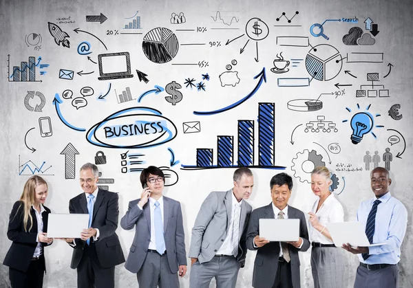 Business people with business symbols — Stock Photo, Image