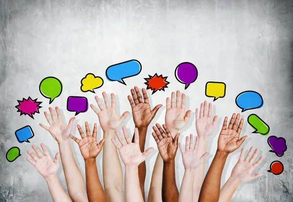 People's Hands Raised with Speech Bubbles — Stock Photo, Image