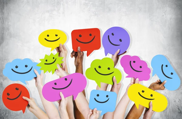 Hands Holding Smiley Faces Icons — Stock Photo, Image