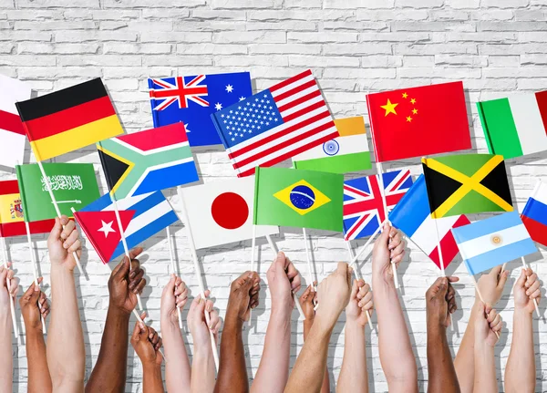 Different countries united with flags raised — Stock Photo, Image