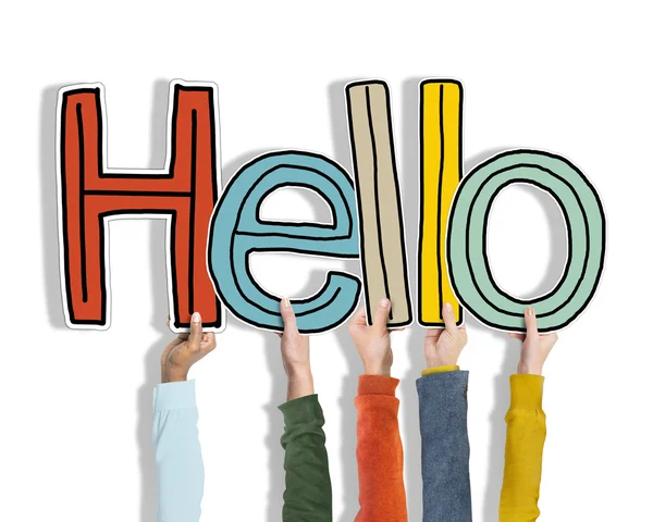 Zróżnicowane ręce trzymając Word Hello — Zdjęcie stockowe
