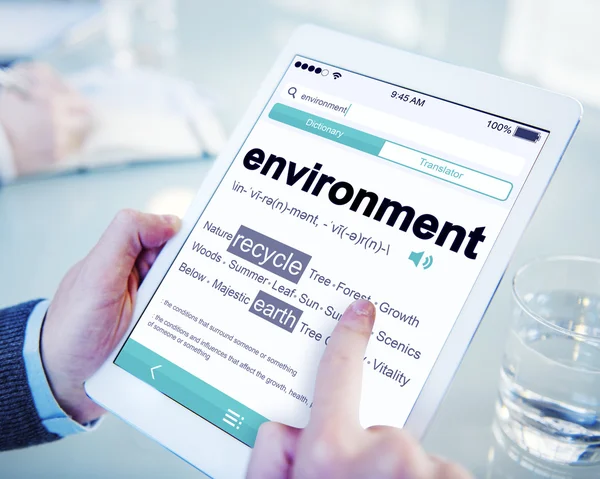 Man Reading the Definition of Environment — Stock Photo, Image