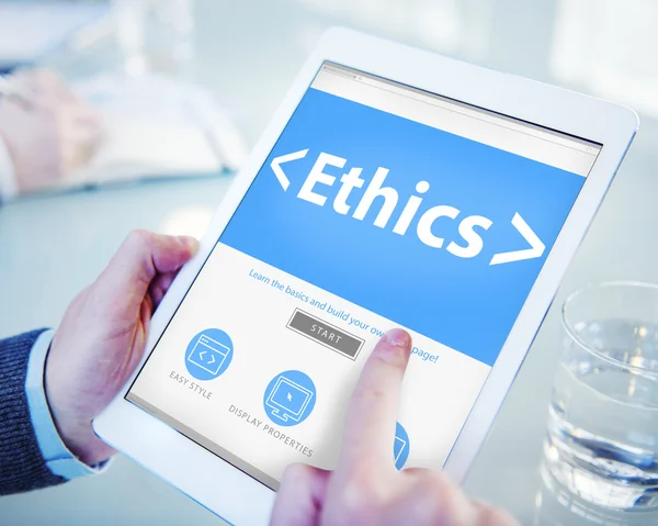 Businessman holding tablet with Ethics Concept — Stock Photo, Image