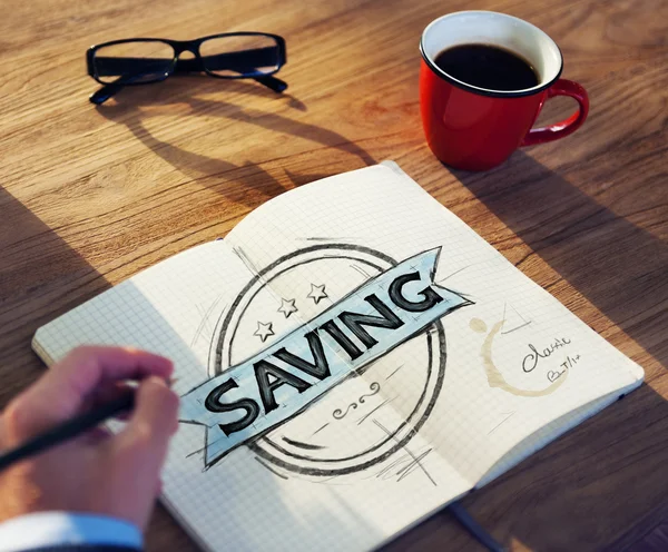 Biznesmen w tabeli z koncepcja oszczędności — Zdjęcie stockowe