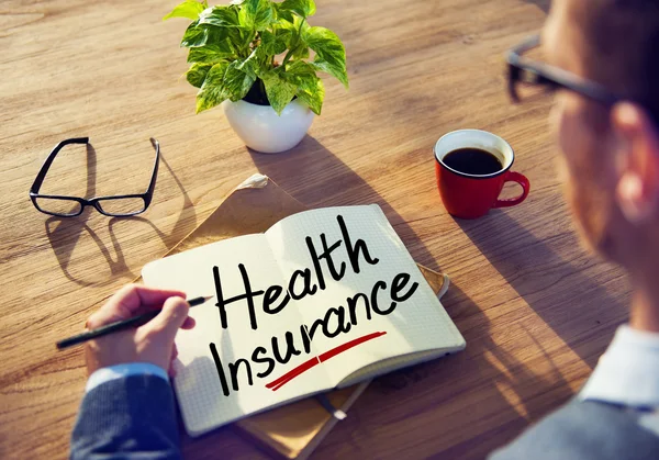 Man Brainstorming with Health Insurance — Stock Photo, Image