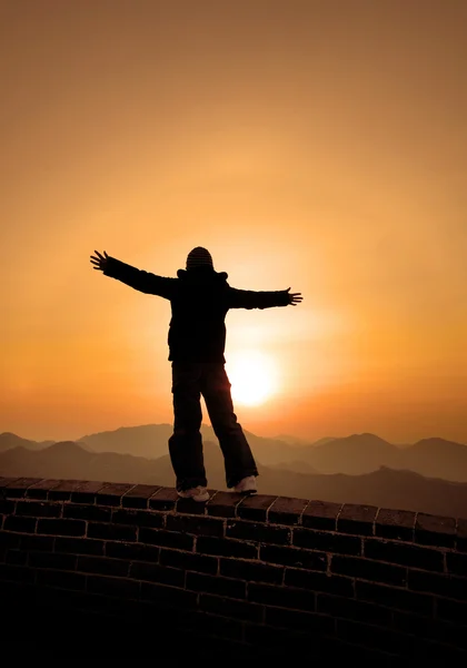 Woman raised hands during sunset — Stock Photo, Image