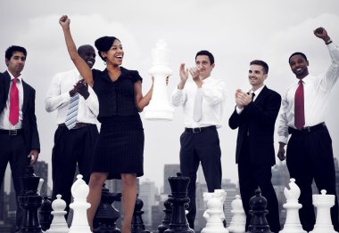 Business People Winning Chess Game clipart