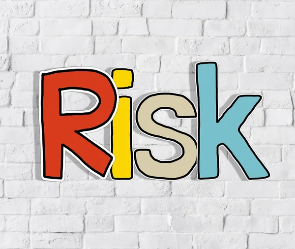 Słowo ryzyko na cegły ściany — Zdjęcie stockowe