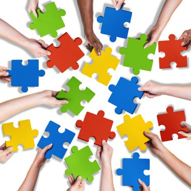 Diverse Hands Holding Jigsaw Puzzle clipart