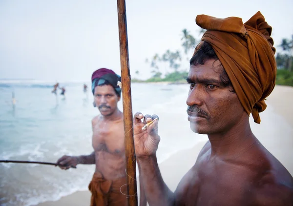 Fisherman smoking — Stock Photo, Image