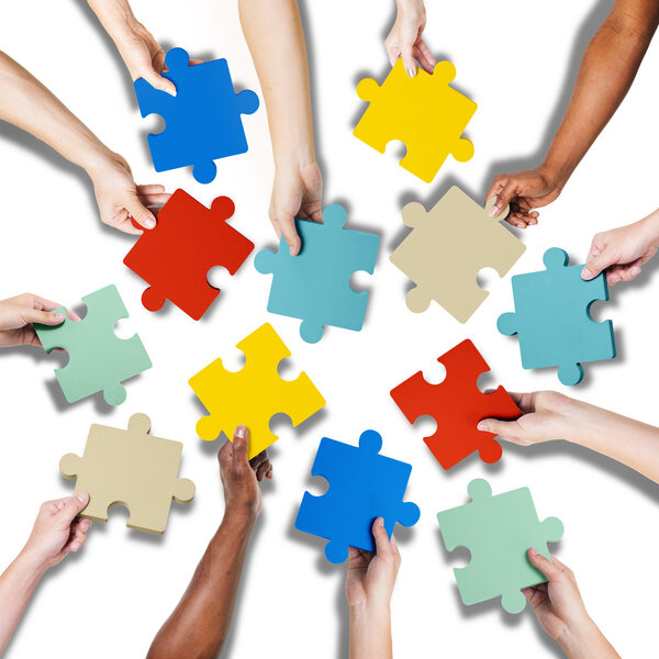 Hands Holding Jigssaw Puzzle