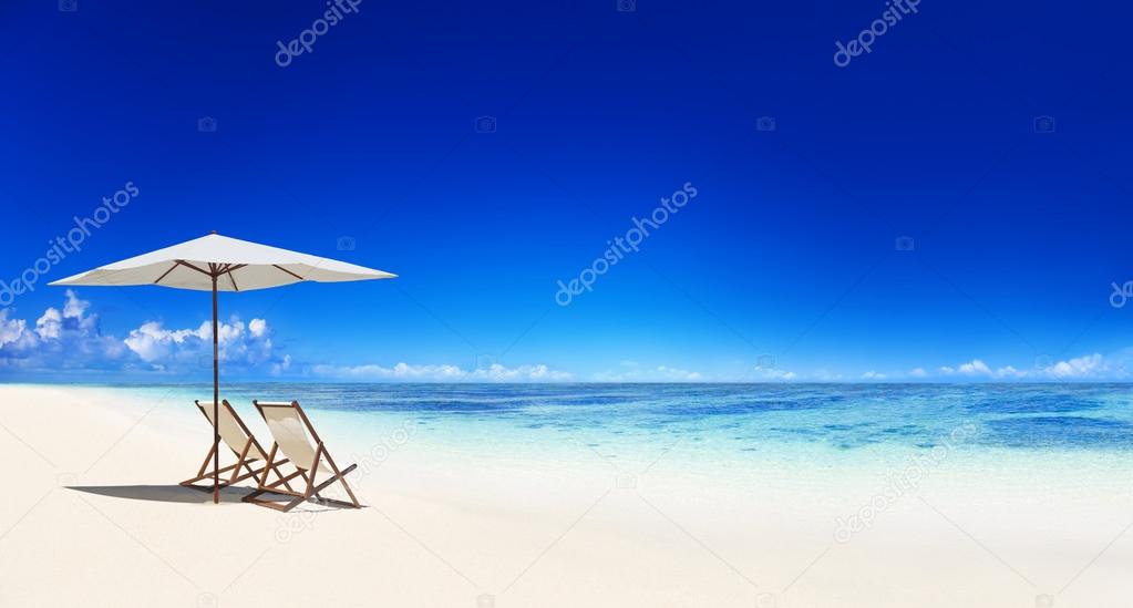Deck chairs on tropical beach