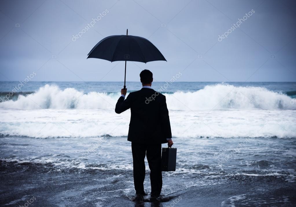 Lonely Businessman Alone in Beach